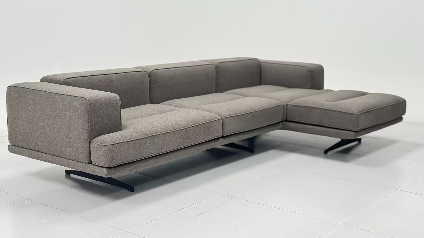 Supplier-provided image of a grey sectional sofa