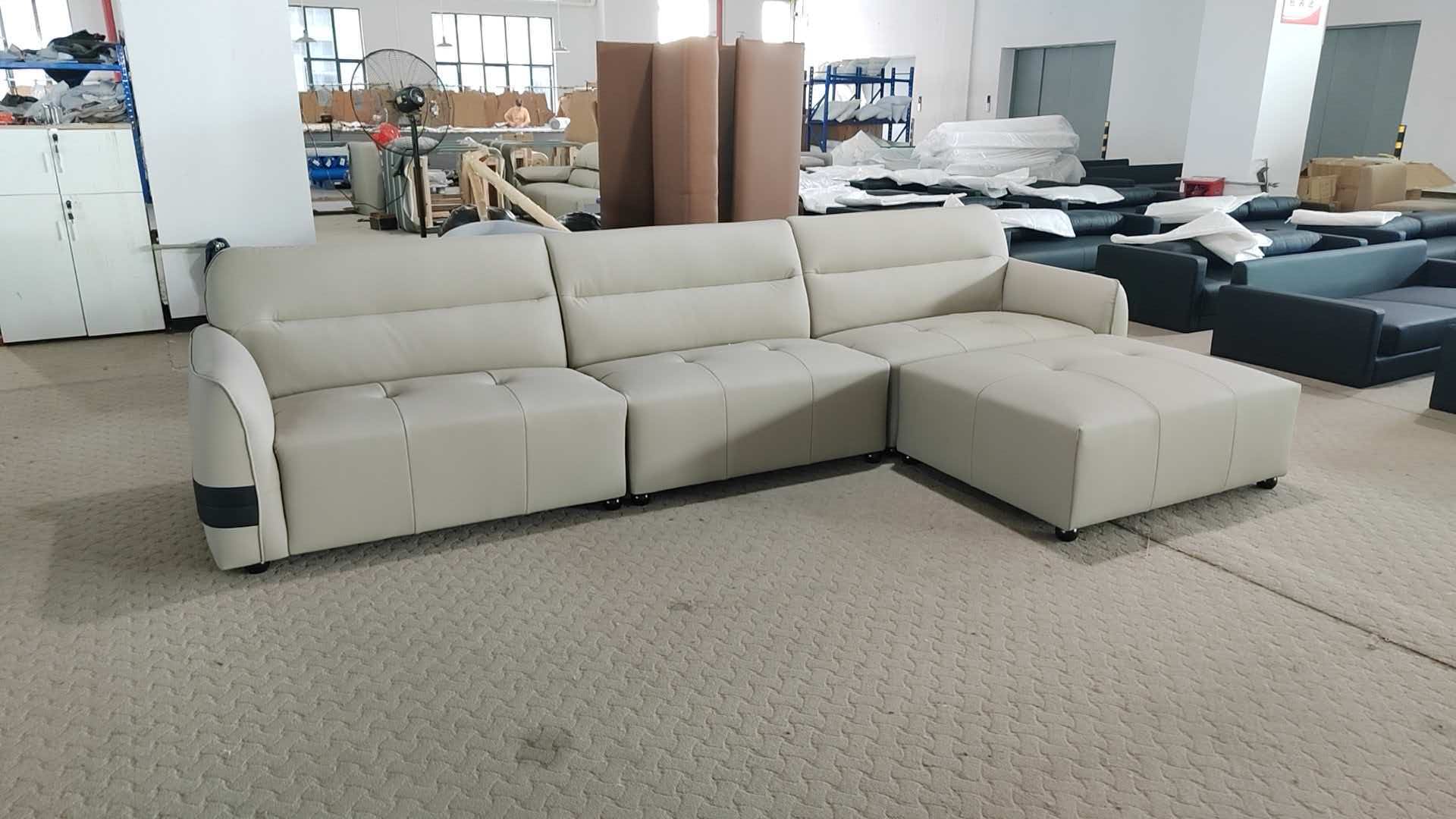 Supplier-provided photograph of a light-coloured corner sofa; materials and dimensions are not stated.